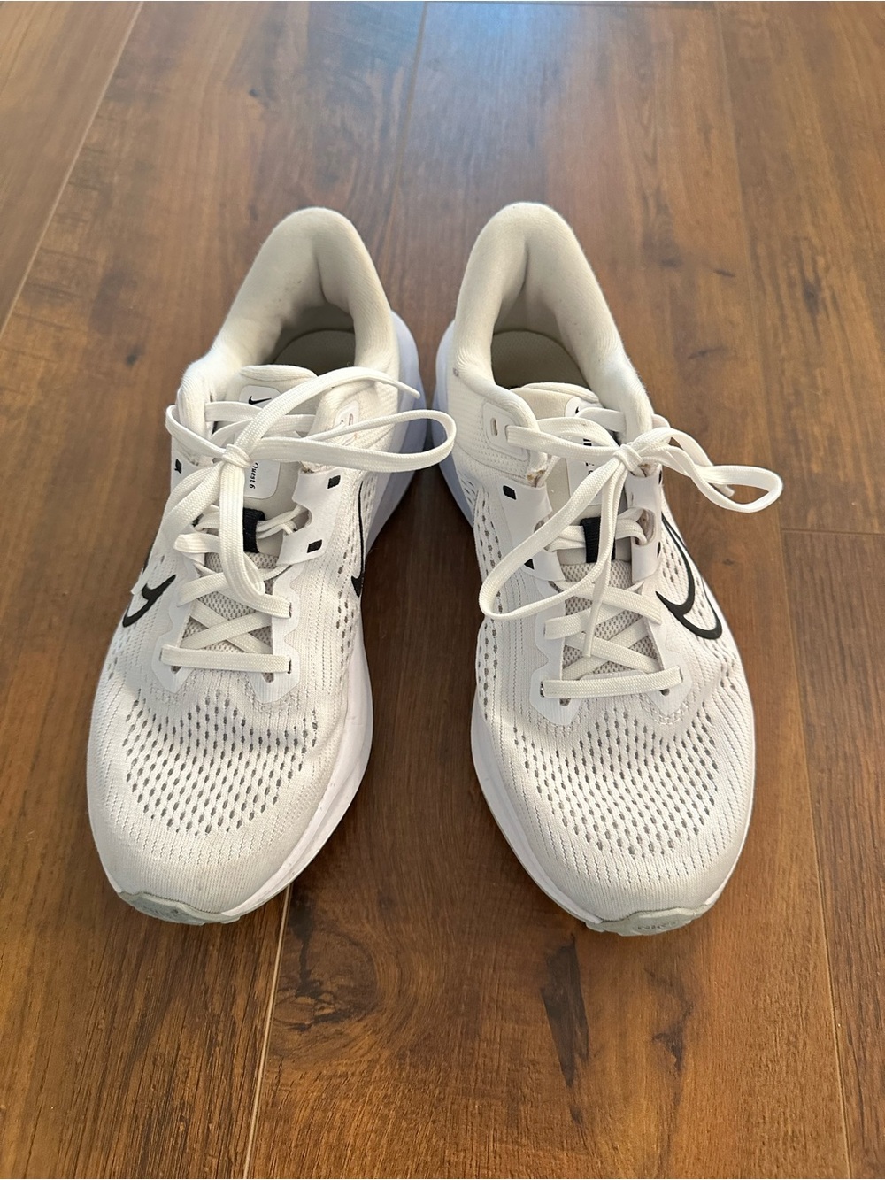 Nike Women's White Athletic Running Shoes with Black Swoosh